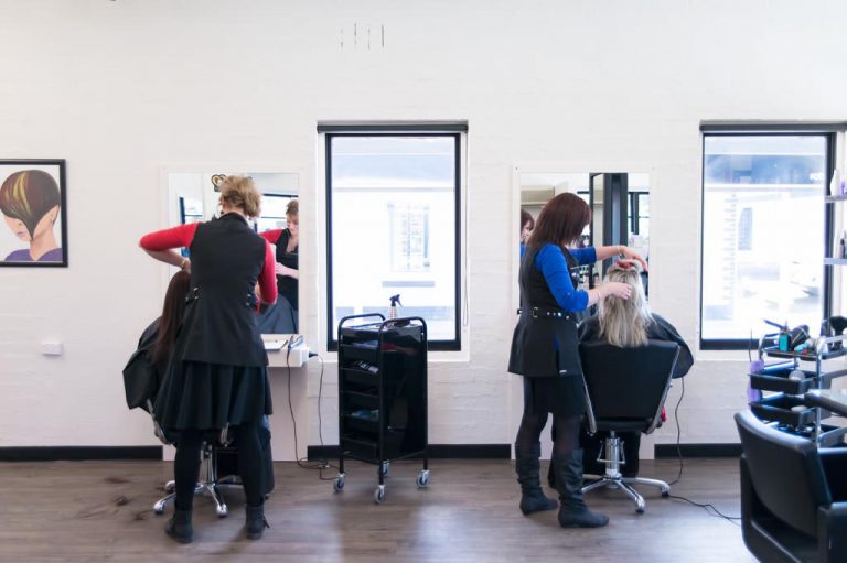 Staff members cutting and styling hair in the salonExeter Hair and